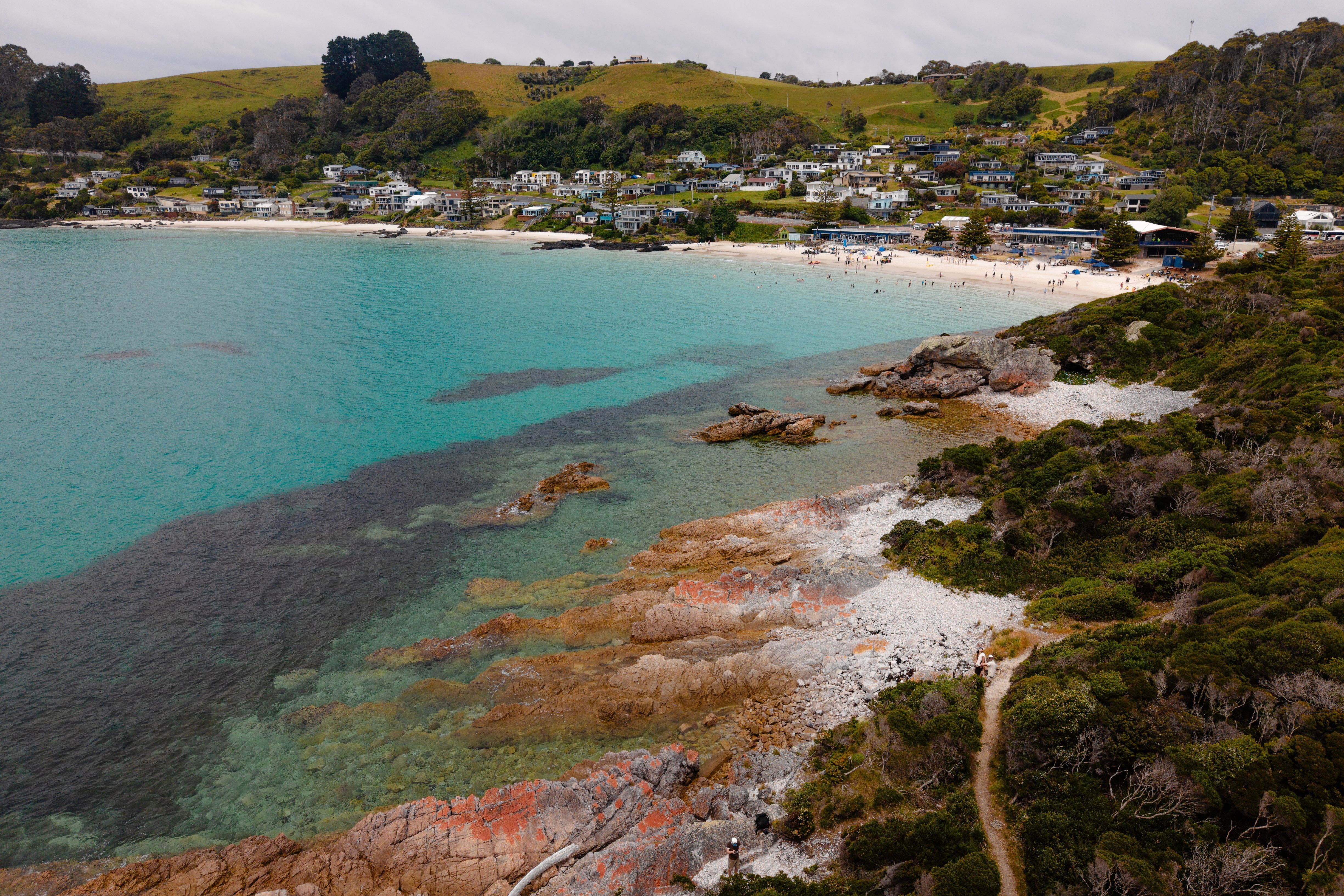 Aerial view of Boat Harbour Beach with white sand and turquoise water seen from a coastal headland, North West Tasmania