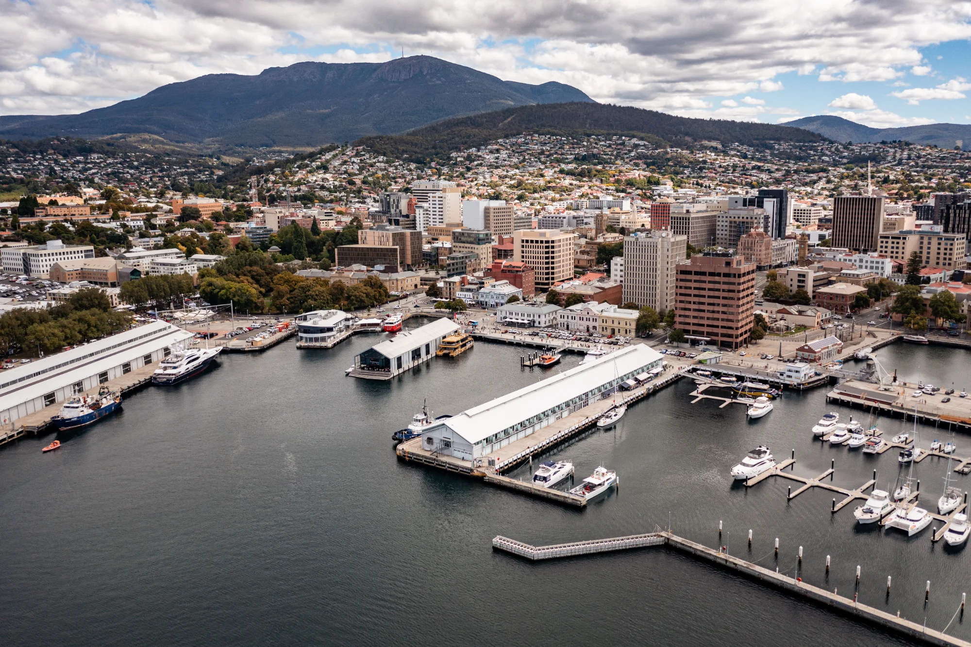 Aerial view of Hobart waterfront and CBD with kunanyi / Mount Wellington in the background, Tasmania