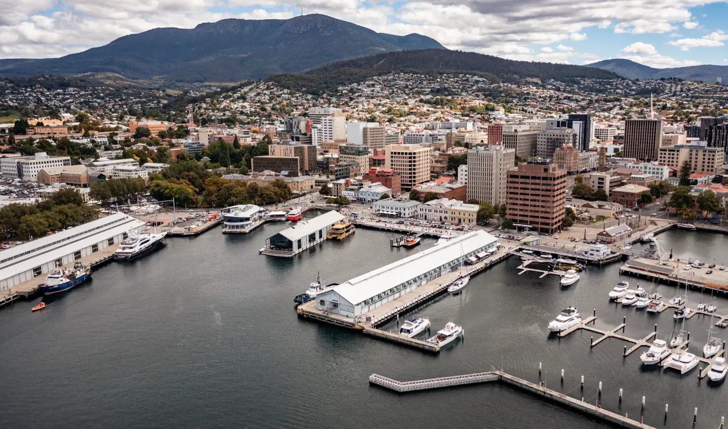 Aerial view of Hobart waterfront and CBD with kunanyi / Mount Wellington in the background, Tasmania