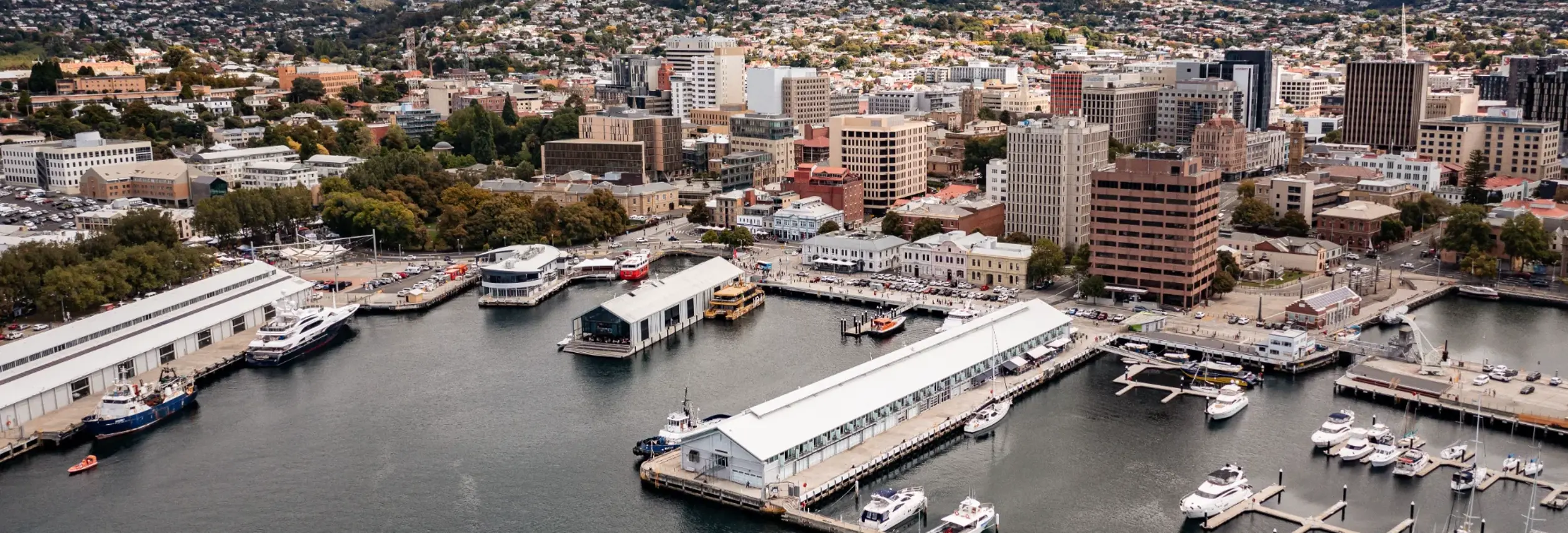 Aerial view of Hobart waterfront and CBD with kunanyi / Mount Wellington in the background, Tasmania