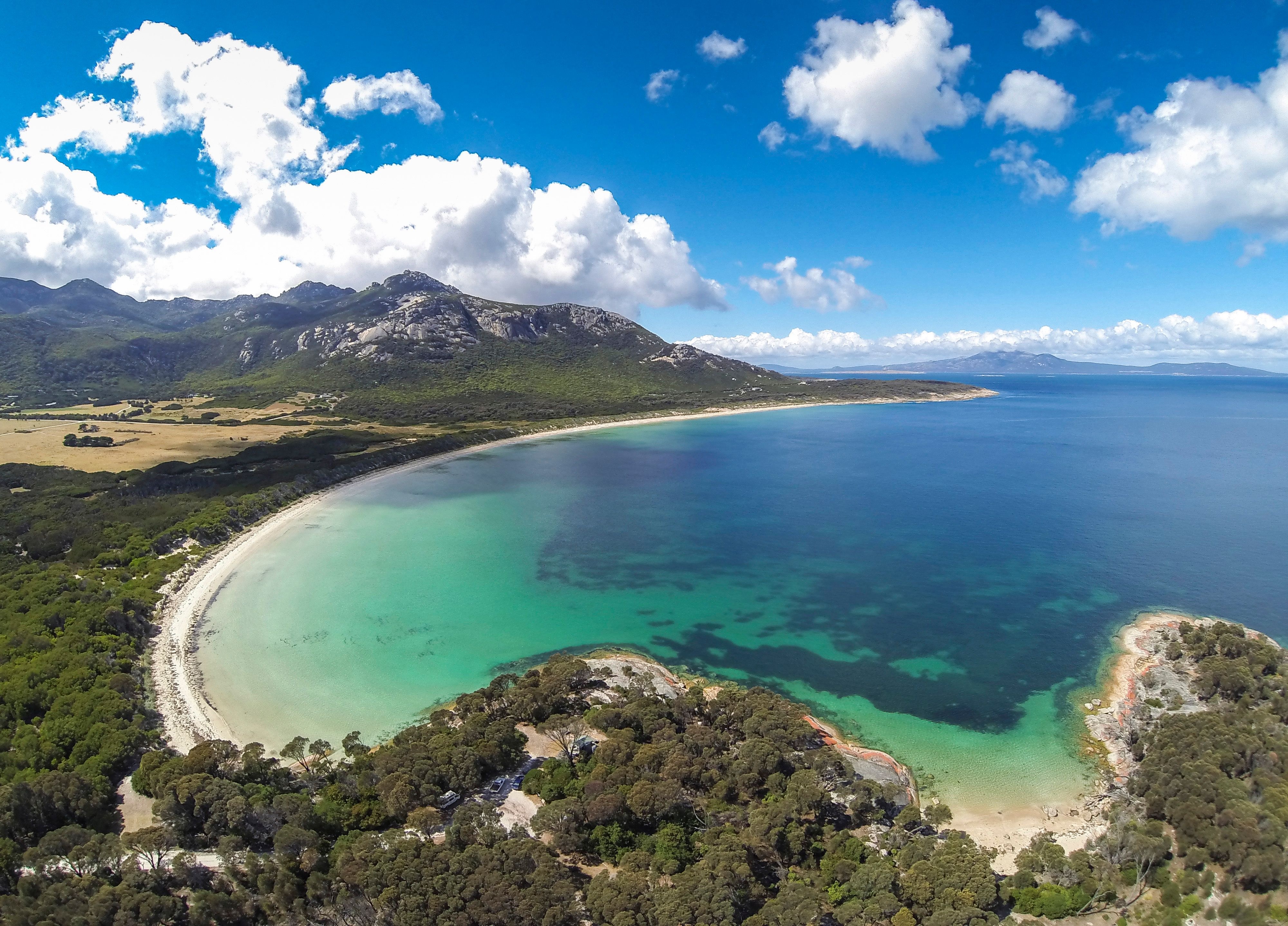Aerial view of turquoise water and white sand at Trousers Point Beach in Strzelecki National Park on Flinders Island