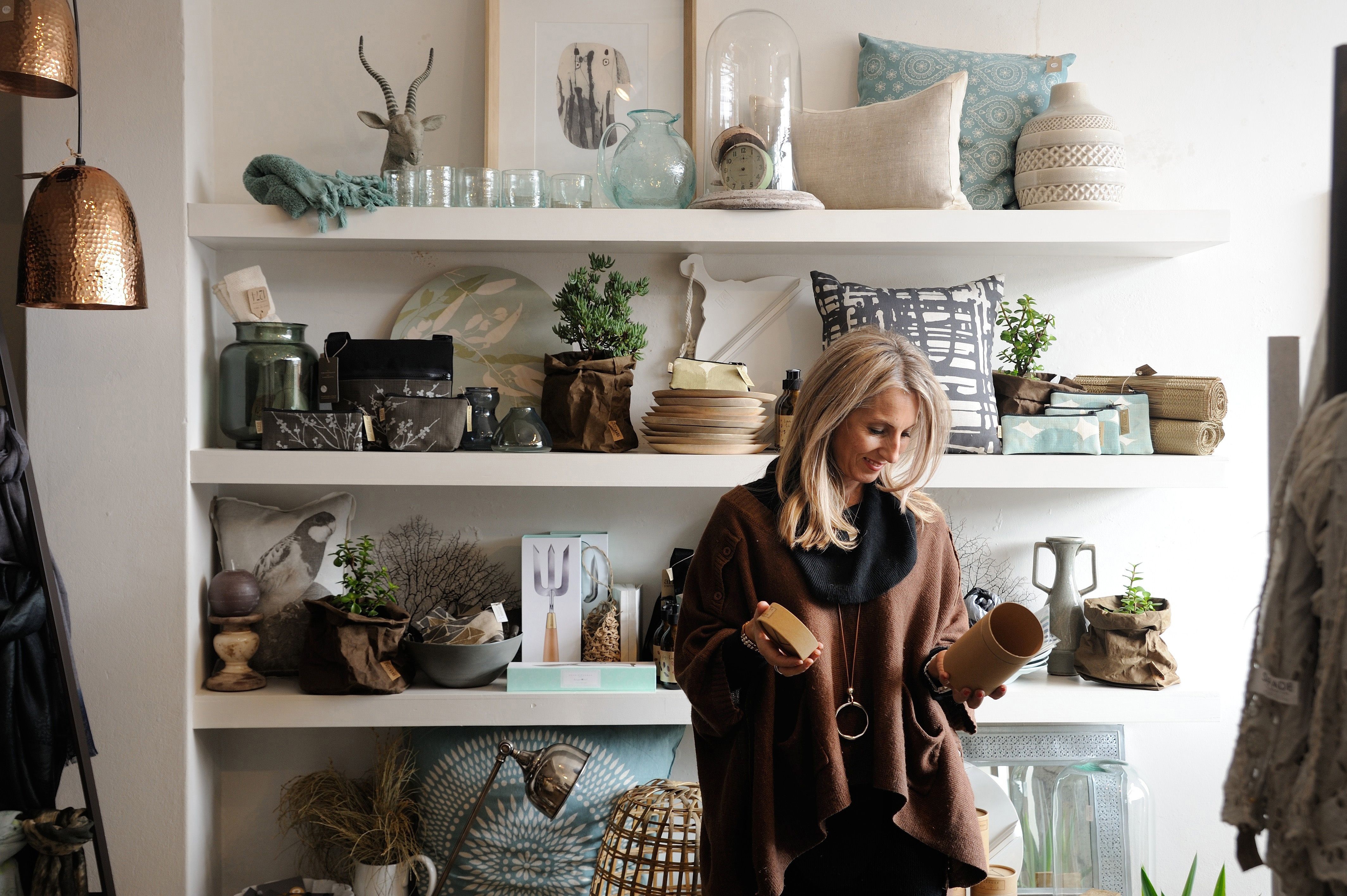 A shopper examining items in a homewares store, Launceston, Tasmania