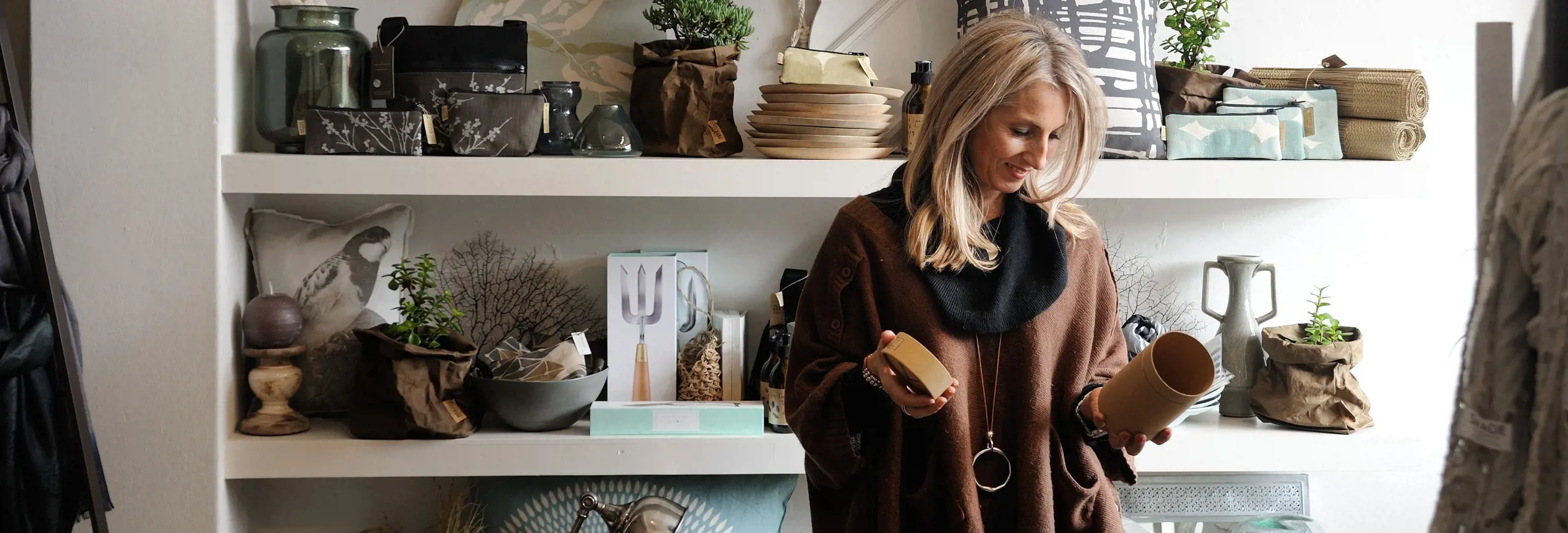 A shopper examining items in a homewares store, Launceston, Tasmania