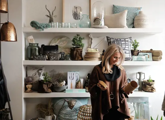 A shopper examining items in a homewares store, Launceston, Tasmania