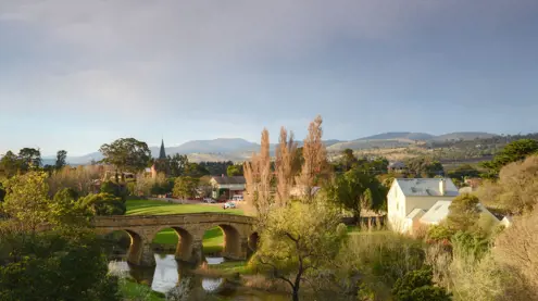 Richmond Bridge over the Coal River with church spire and colonial-era town beyond, Richmond, Tasmania