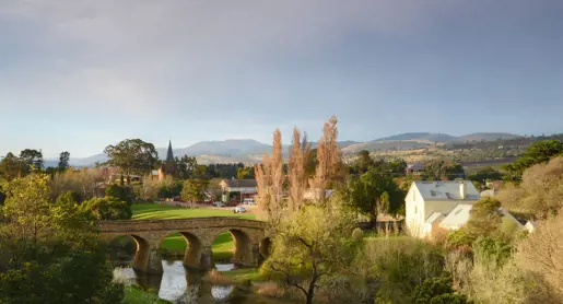 Richmond Bridge over the Coal River with church spire and colonial-era town beyond, Richmond, Tasmania