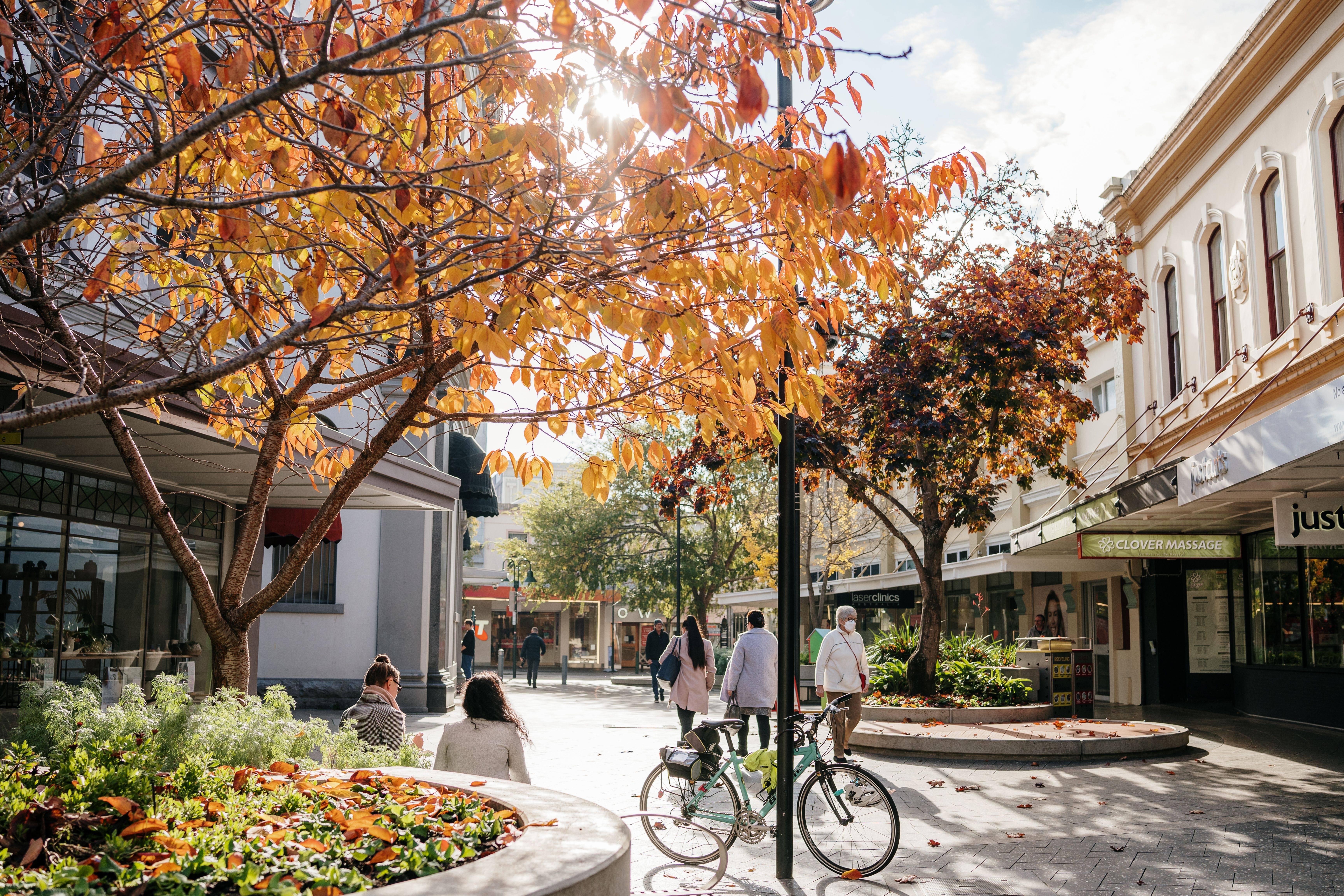 Autumn leaves over Quadrant Mall with shoppers and heritage buildings, Launceston, Tasmania