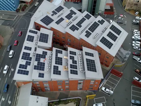 Aerial view of solar panels on the rooftops of The Old Woolstore Apartment Hotel, Hobart, Tasmania