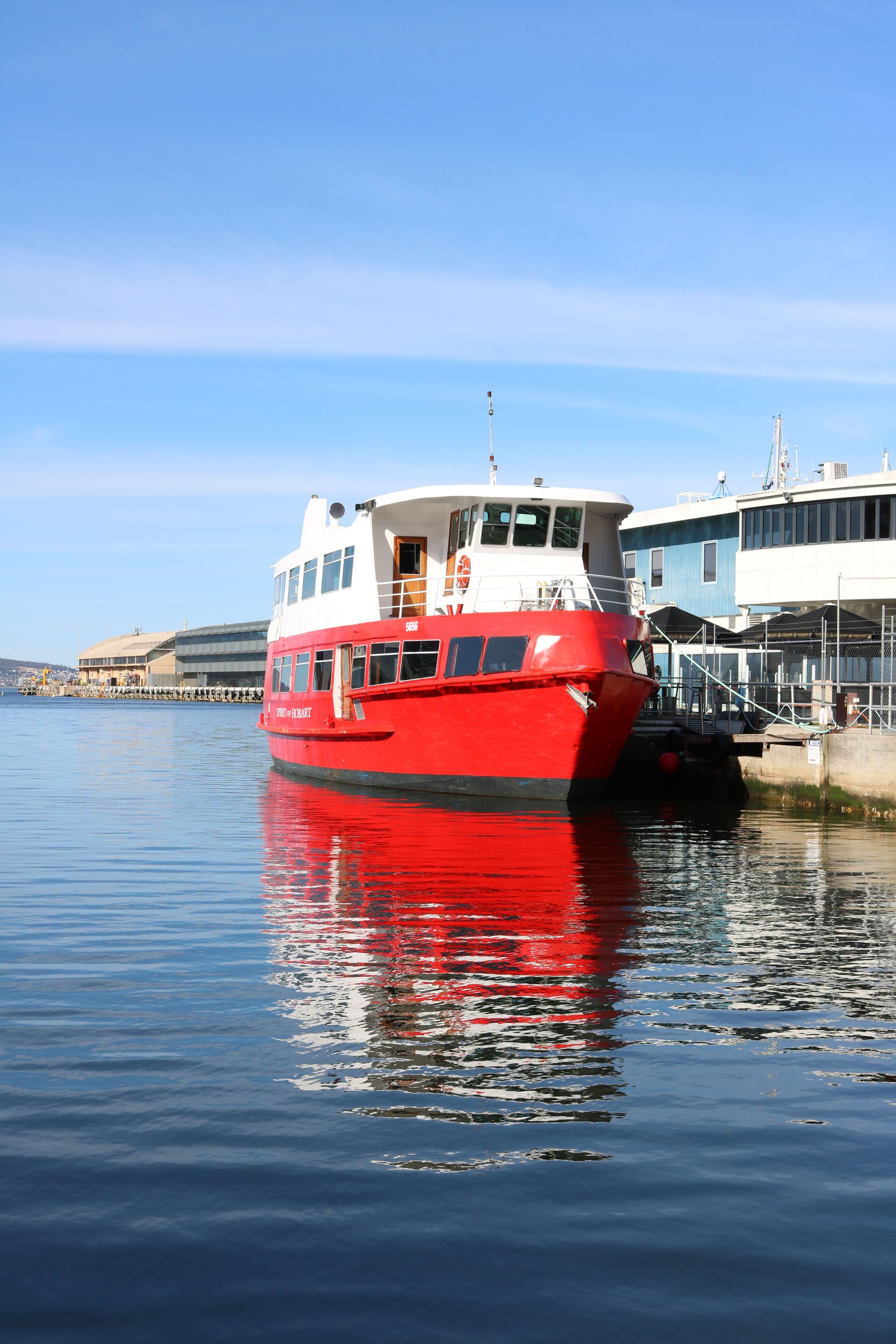The red Spirit of Hobart cruise vessel docked at Murray Street Pier with Hobart Historic Cruises, Hobart, Tasmania