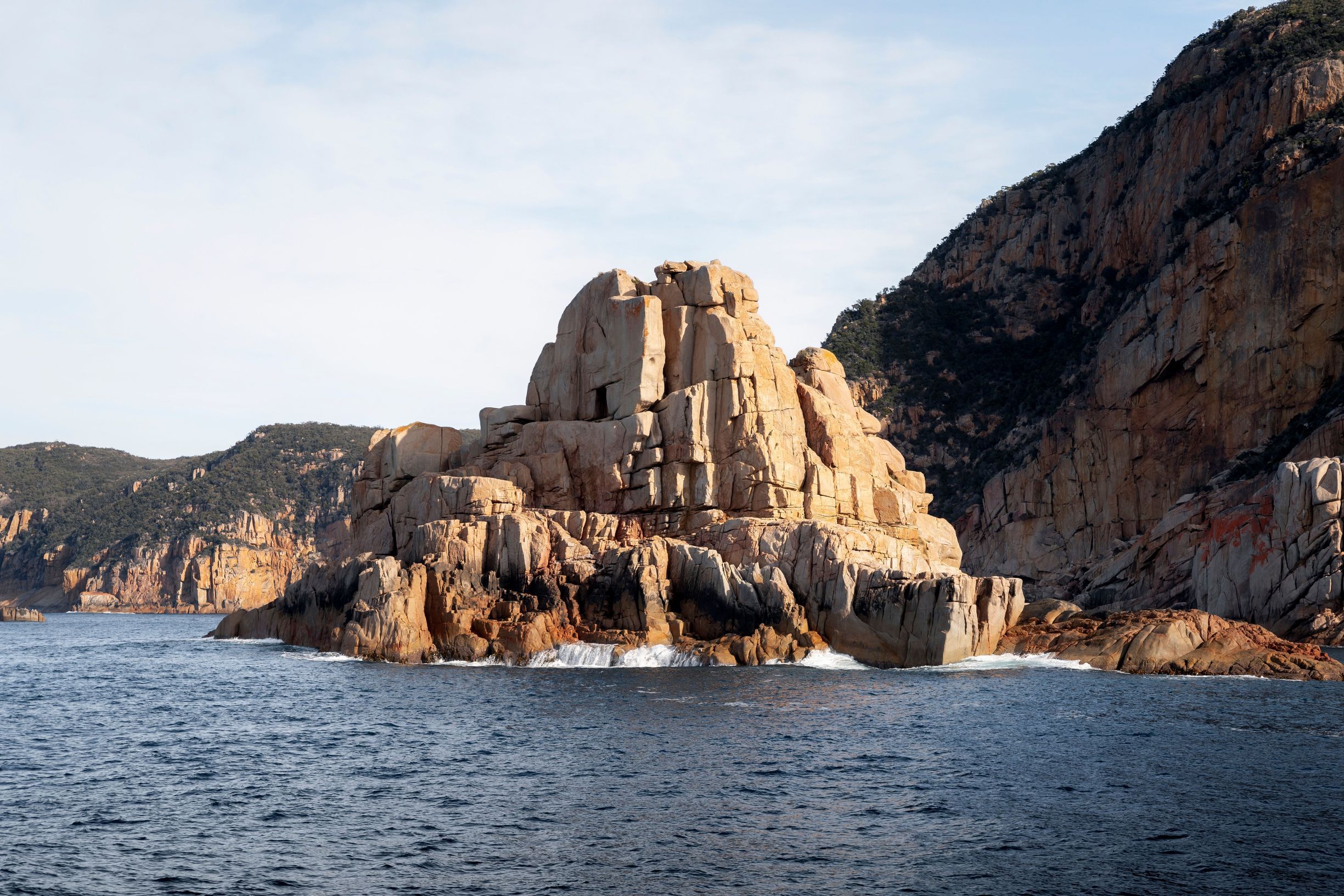 Granite rock formation rising from the sea on a Wineglass Bay Cruises eco cruise