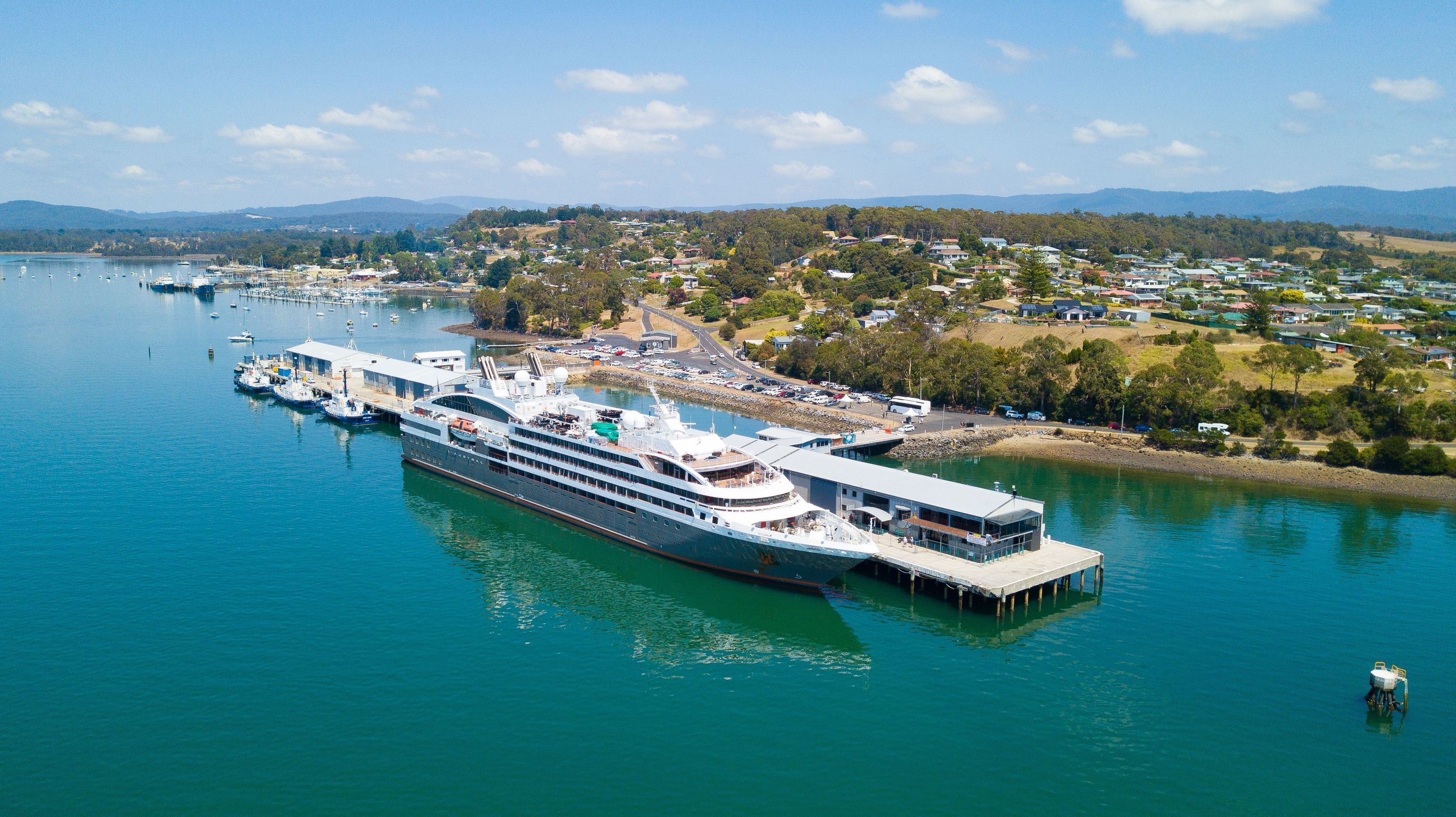 Aerial view of L'Austral cruise ship docked at Beauty Point on the kanamaluka / River Tamar