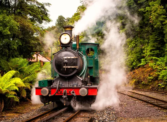 A green steam train on the West Coast Wilderness Railway between Queenstown and Strahan, Tasmania