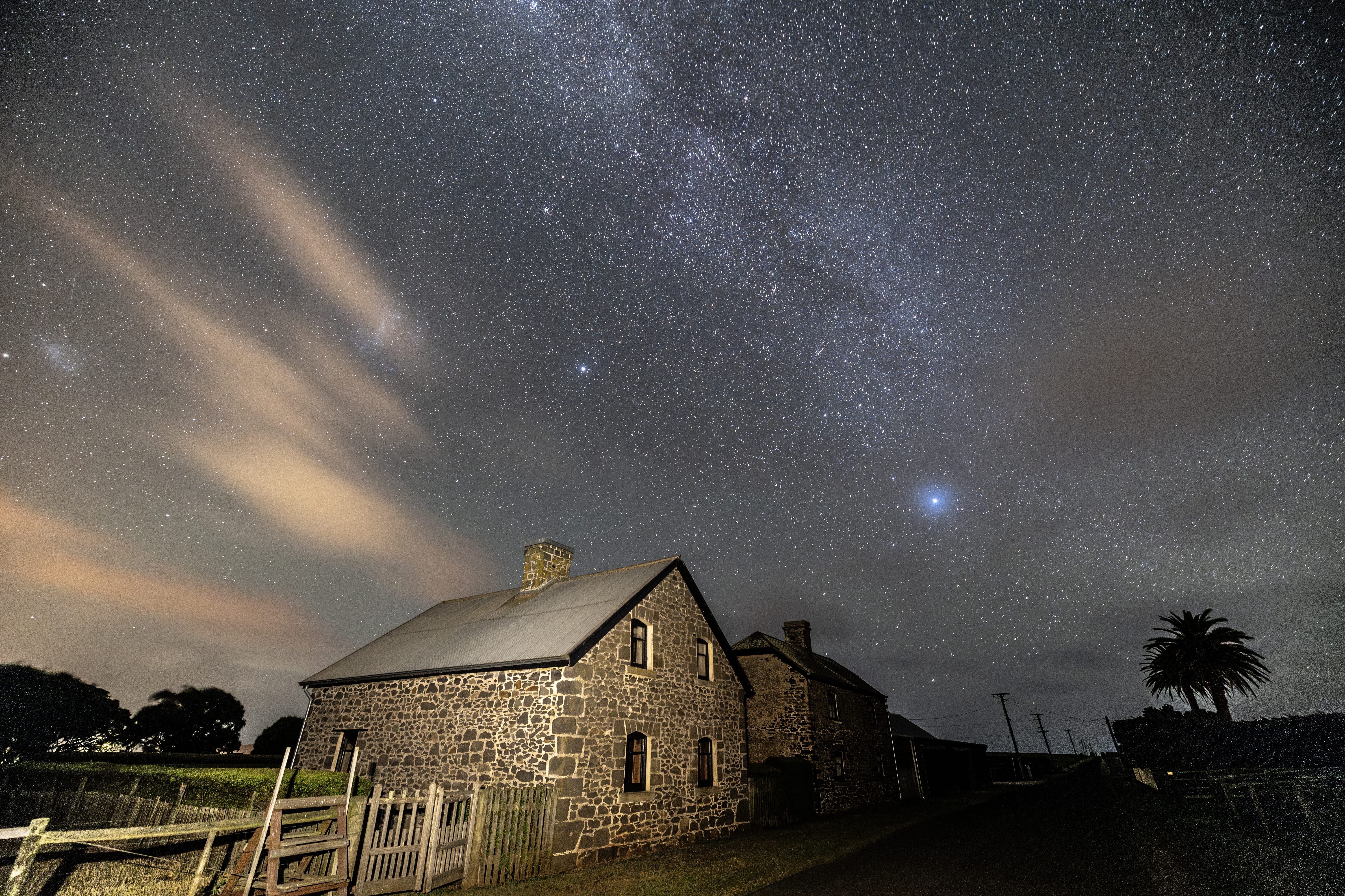 Heritage stone homestead beneath the Milky Way at Highfield Historic Site, Stanley, Tasmania