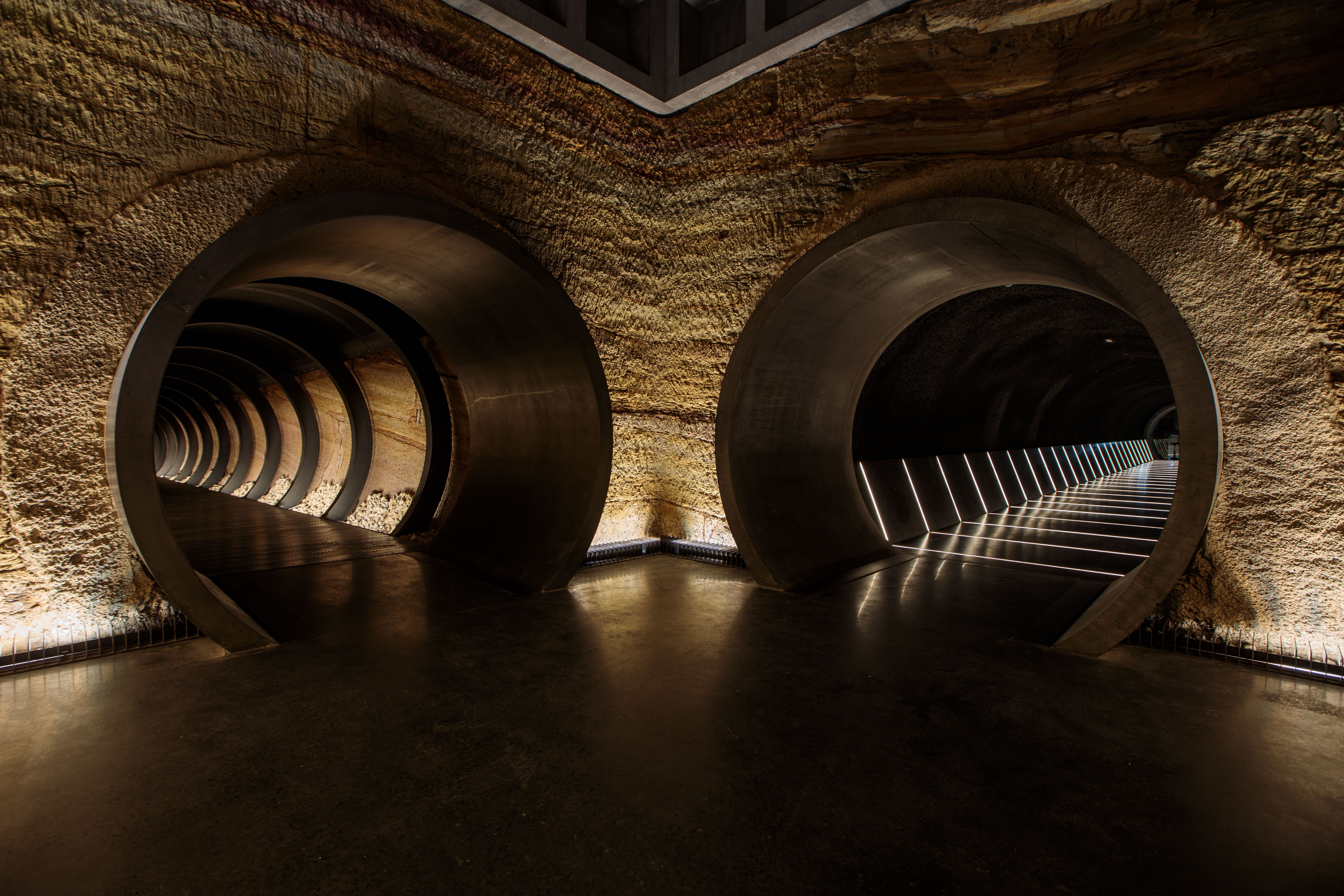 Circular tunnel entrances at Siloam underground gallery, Museum of Old and New Art (Mona), Berriedale, Tasmania