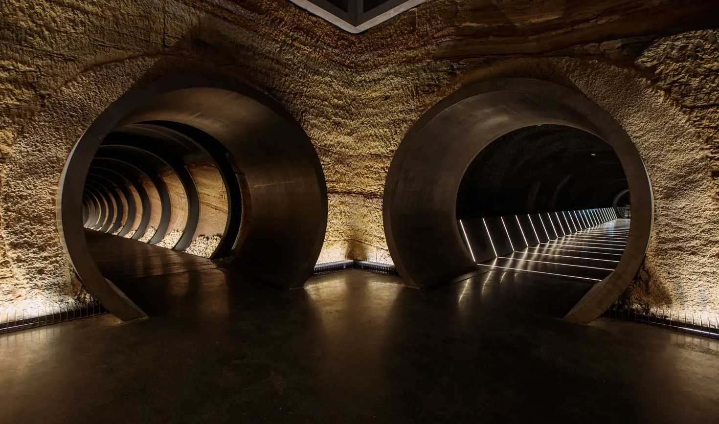 Circular tunnel entrances at Siloam underground gallery, Museum of Old and New Art (Mona), Berriedale, Tasmania