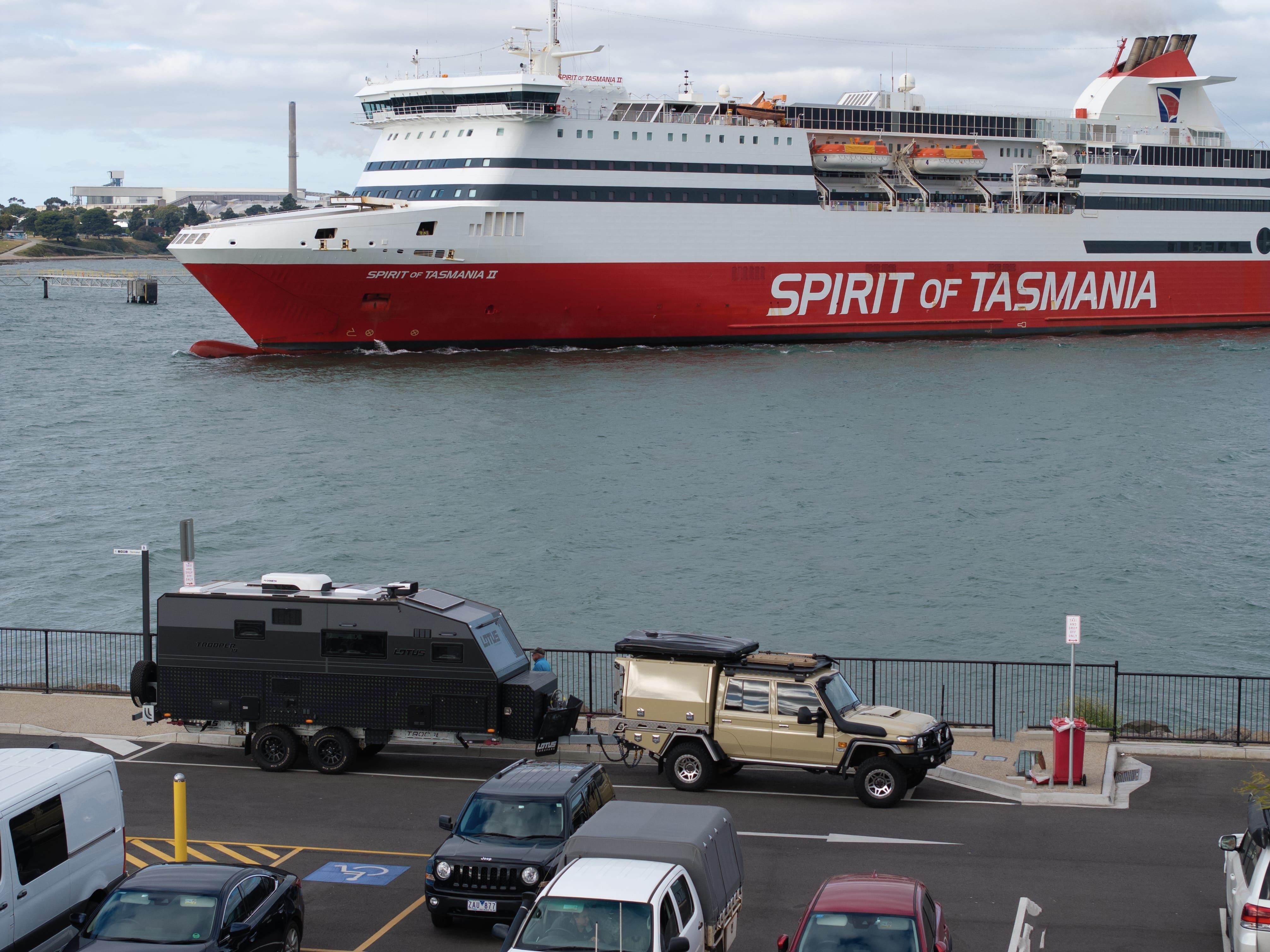 A 4WD towing a caravan in the queue to board the Spirit of Tasmania II ferry, Devonport, Tasmania