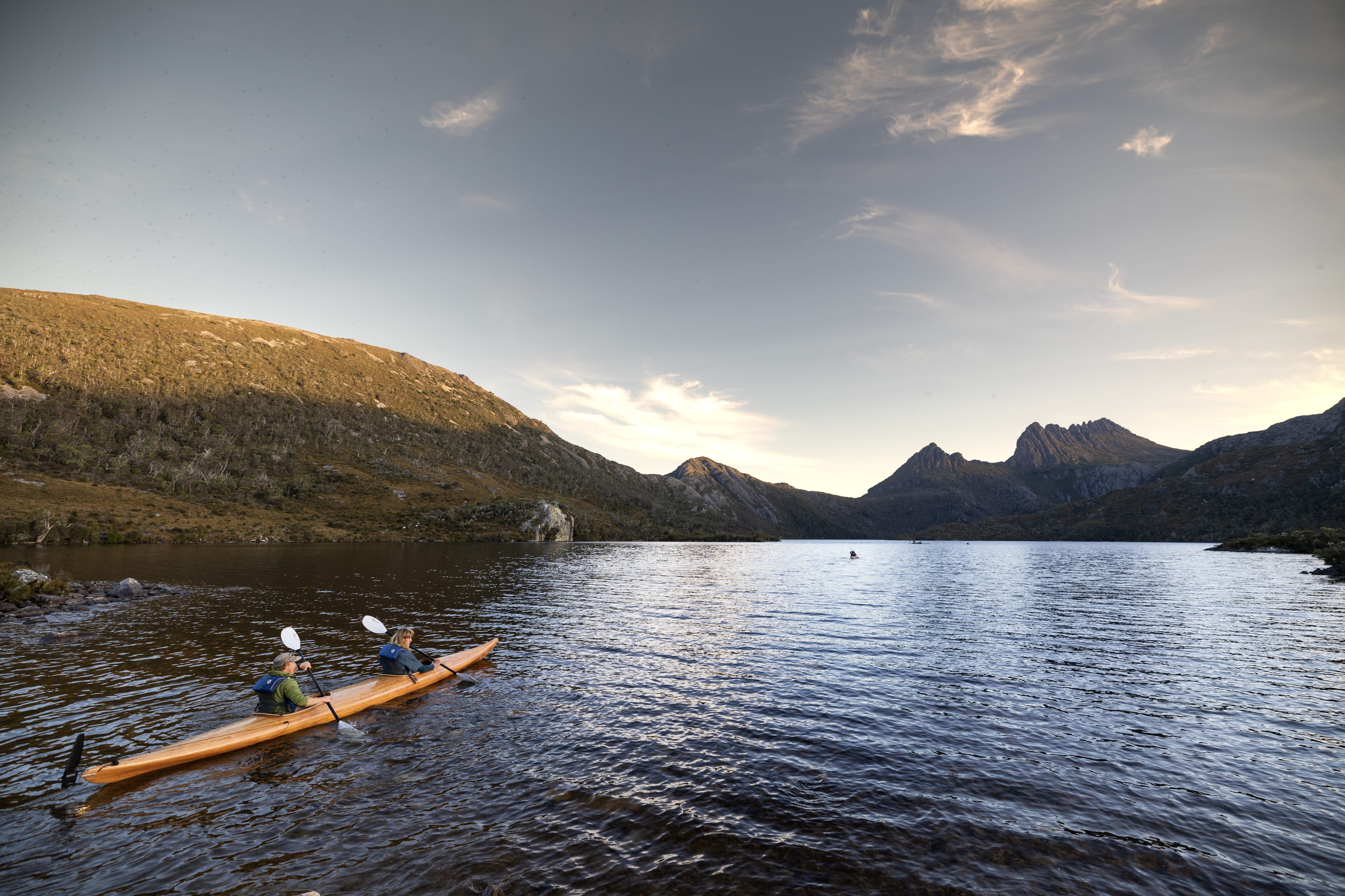 Two kayakers paddling on Dove Lake with Cradle Mountain behind, Cradle Mountain-Lake St Clair National Park, Tasmania