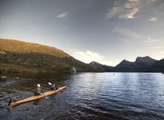 Two kayakers paddling on Dove Lake with Cradle Mountain behind, Cradle Mountain-Lake St Clair National Park, Tasmania