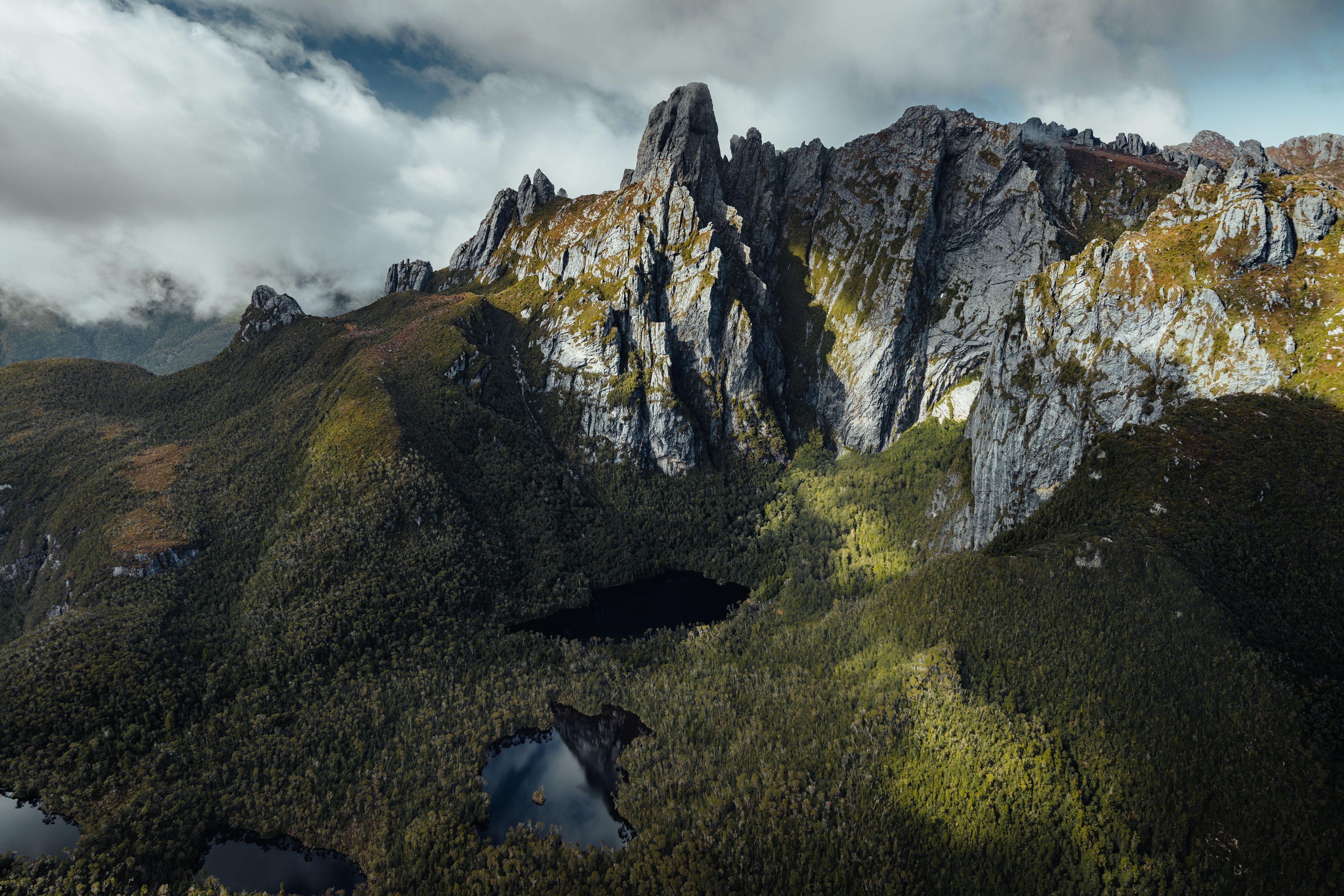 Aerial view of Federation Peak's jagged quartzite spires above tarns and wilderness, Southwest National Park