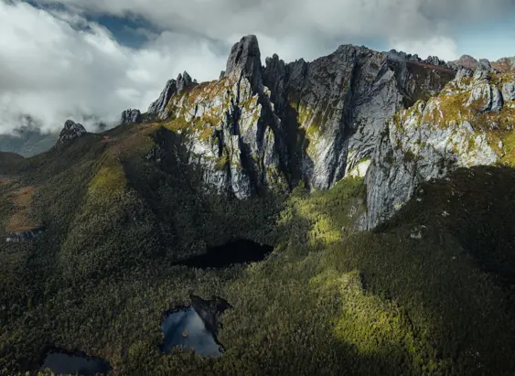 Aerial view of Federation Peak's jagged quartzite spires above tarns and wilderness, Southwest National Park