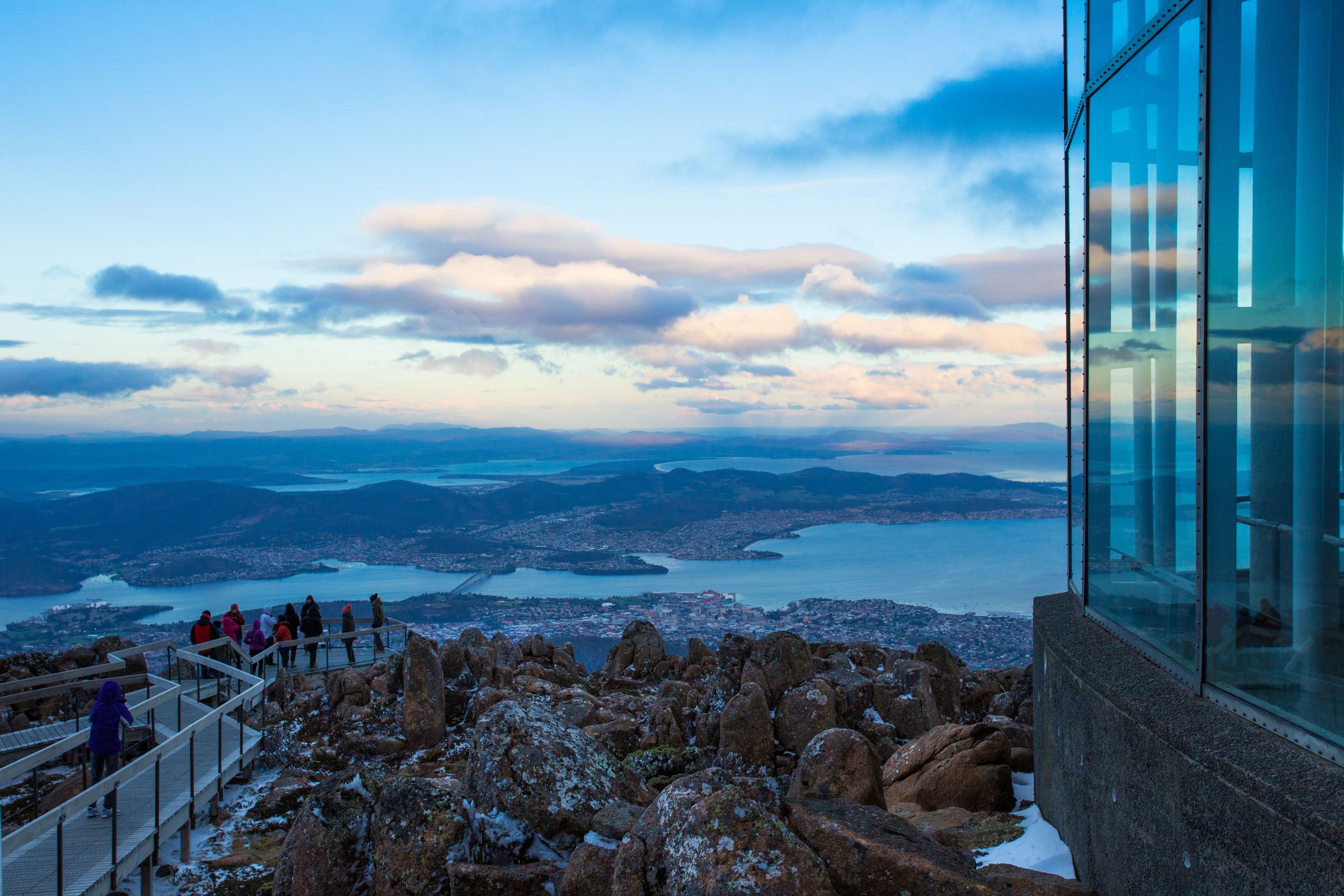 People on the lookout viewing Hobart and the River Derwent from kunanyi / Mount Wellington