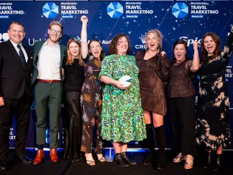 Tourism Tasmania team celebrating their Travel Marketing Team of the Year win at the Mumbrella Travel Marketing Awards, Sydney