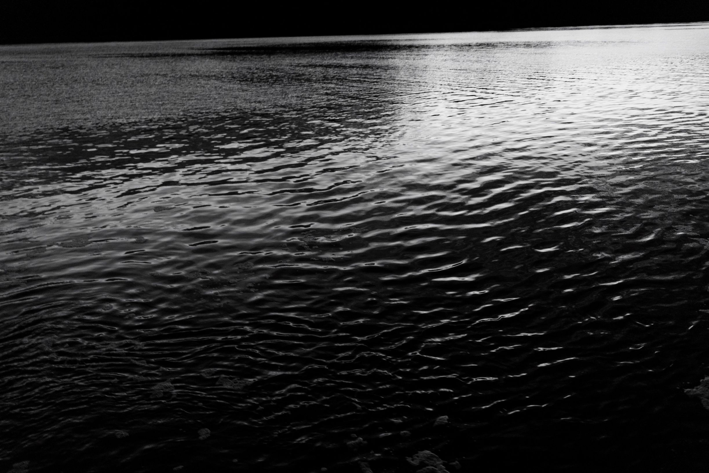 Black and white close-up of rippled water surface in Tasmania