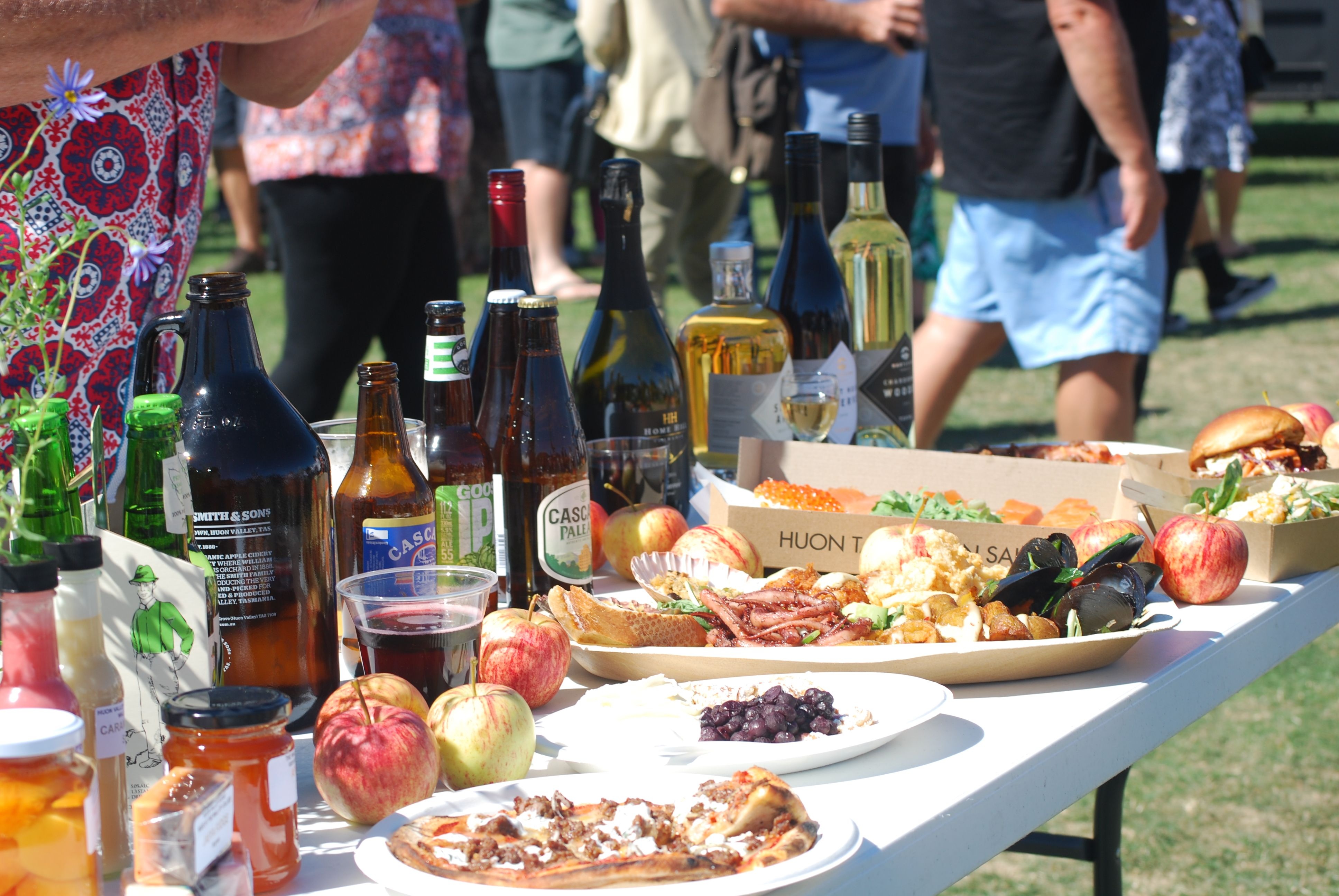 Local food and drinks including apples, seafood and Huon Valley beverages on a table at A Taste of the Huon festival, Ranelagh