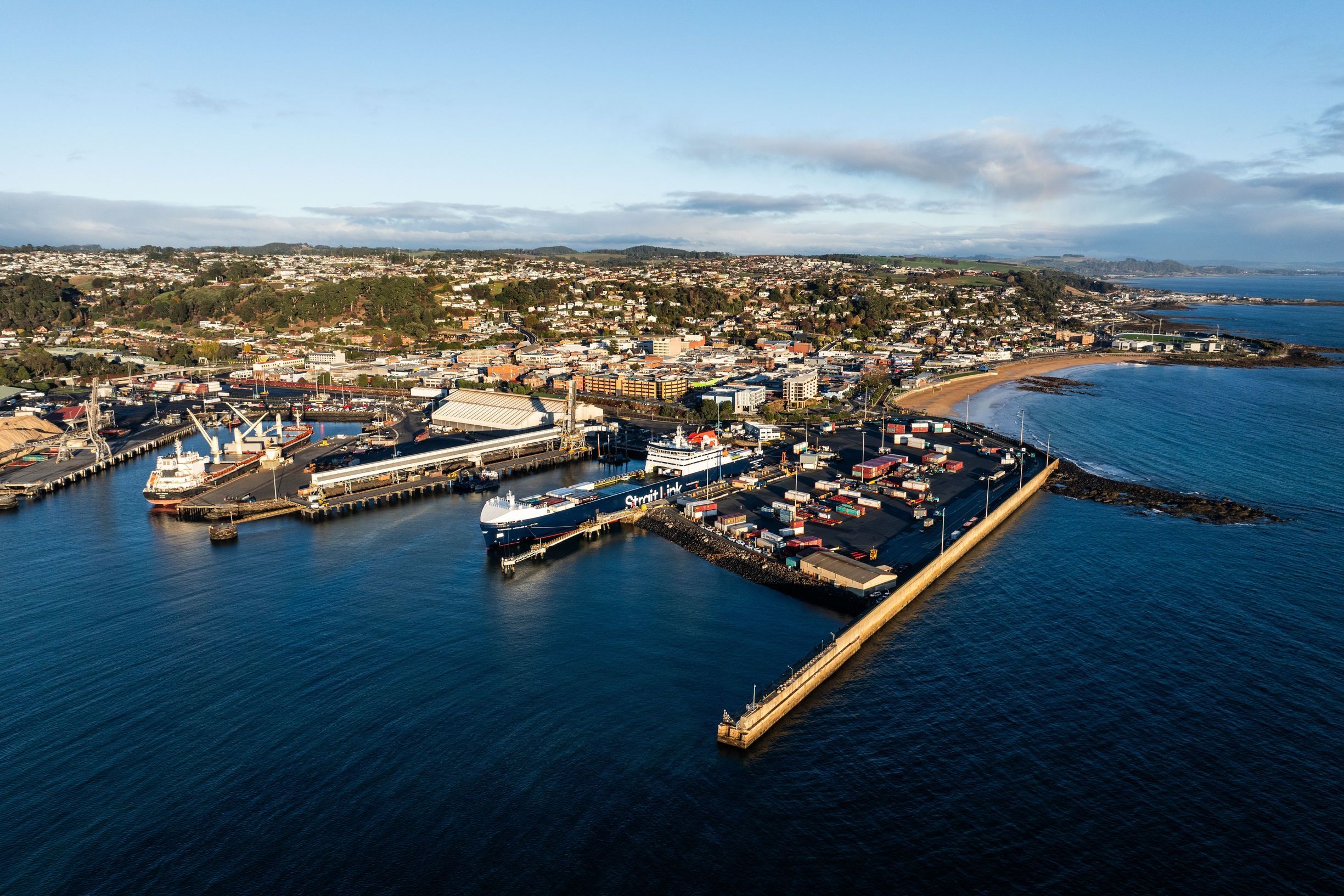 Aerial view of Burnie Port with cargo ships docked and the town beyond