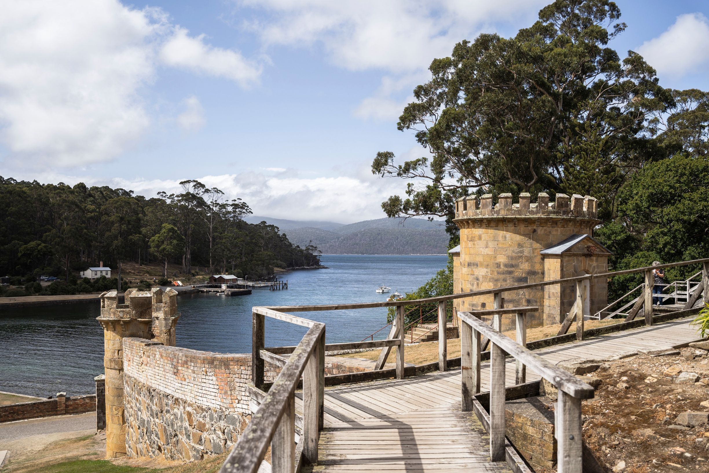 Sandstone guard tower and boardwalk overlooking the harbour at Port Arthur Historic Site, Turrakana / Tasman Peninsula