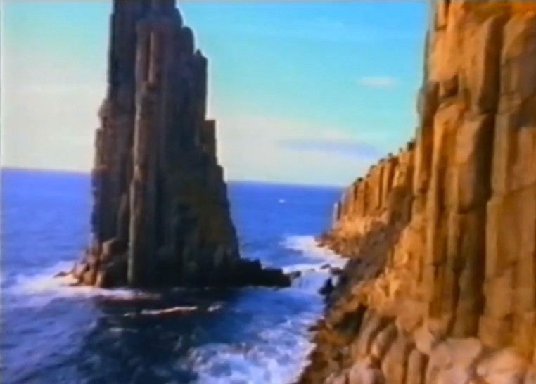 Video screengrab from the 1996 Discover your natural state campaign showing dolerite sea cliffs and a rock pillar off the Tasmanian coast