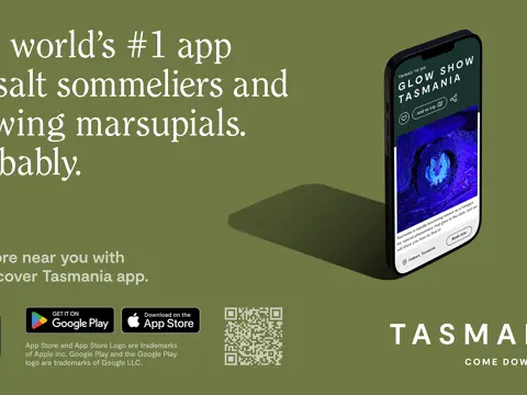 Advertisement for the Discover Tasmania app: the world's #1 app for salt sommeliers and glowing marsupials. Probably.