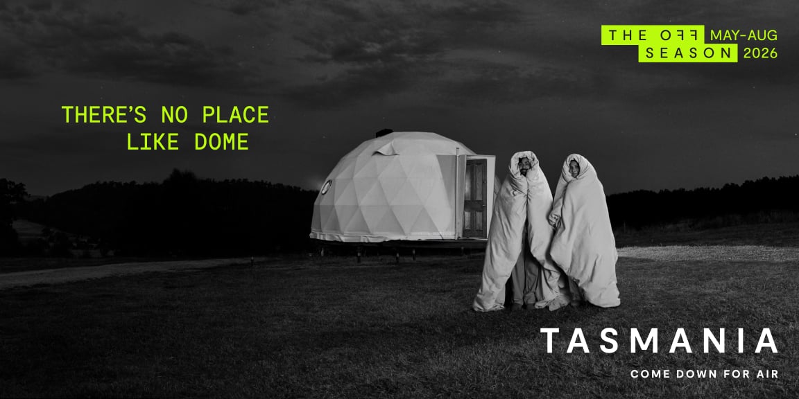 Off Season May-Aug 2026 campaign ad of two people wrapped in duvets outside a glamping dome titled There's No Place Like Dome