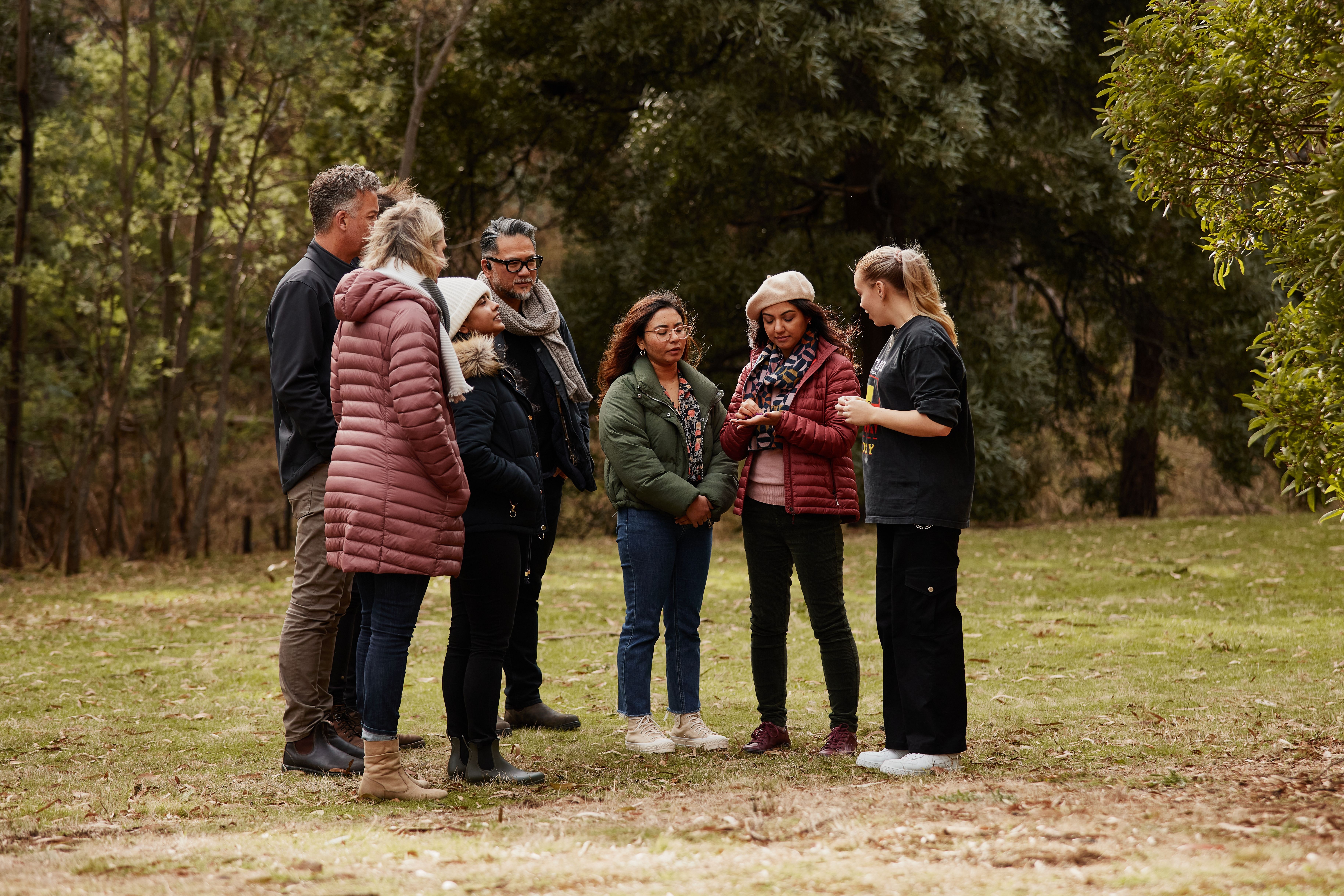 Visitors listen to a guide during a kipli takara tour with palawa kipli, Risdon Cove