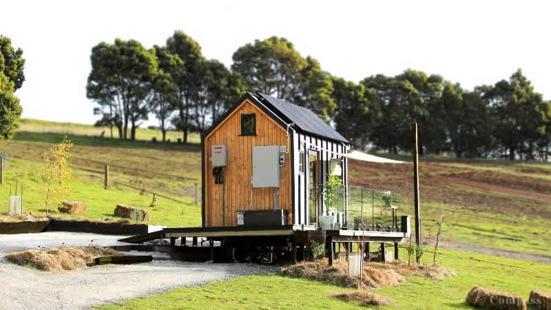 Very small hut in a paddock