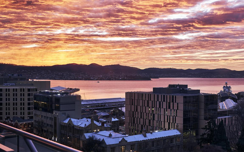 The sun sets on Hobart, seen from the balcony of Seven and Half.